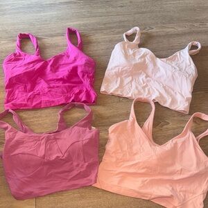 Set of 4 pink lulu align tanks